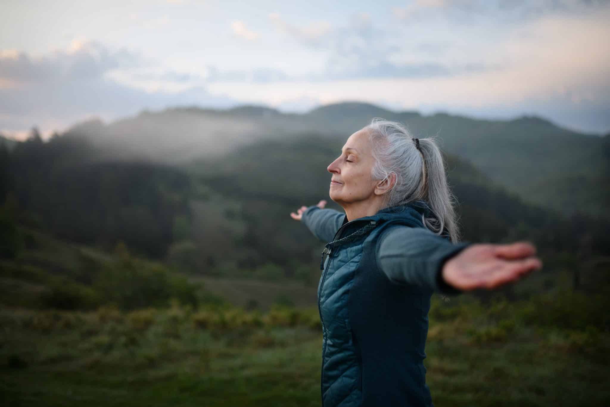 senior-woman-doing-breathing-exercise-2022-06-22-16-34-22-utc-scaled